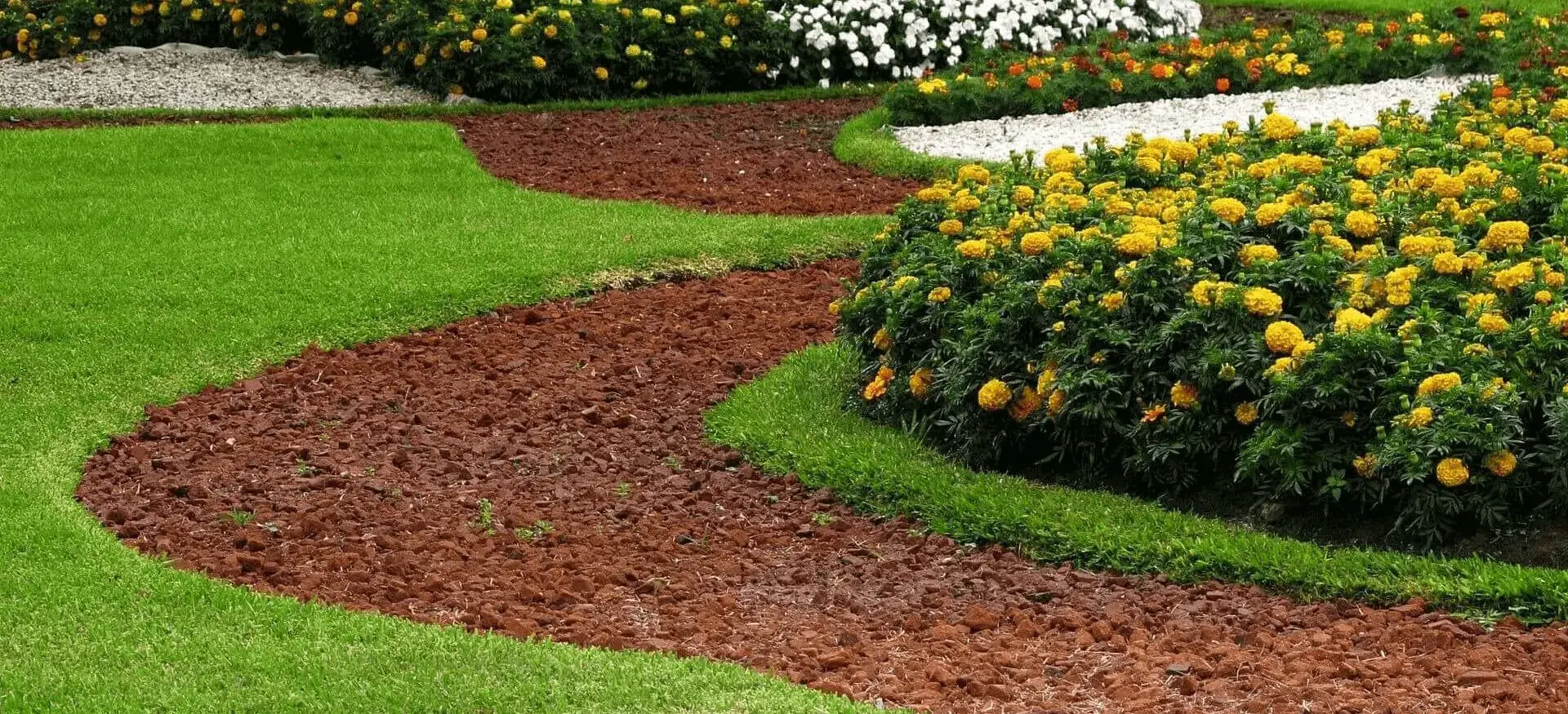 Park design stone pathways in grass with flower beds